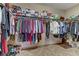 Walk-in closet with organized storage, shelving, and hanging space for clothing and shoes at 3906 Jacob Lake Cir, Las Vegas, NV 89118