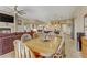 A spacious dining room open to the living room with a fireplace, and the kitchen with a breakfast bar at 3906 Jacob Lake Cir, Las Vegas, NV 89118