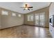 A bright, empty bedroom featuring natural light, tile flooring, and outside access, waiting for personalization at 3906 Jacob Lake Cir, Las Vegas, NV 89118