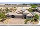 Front view of a single-story home with desert landscaping, brick driveway, and solar panels at 3906 Jacob Lake Cir, Las Vegas, NV 89118