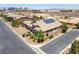 Well-kept single-story house with desert landscaping, two-car garage, and solar panels on the roof at 3906 Jacob Lake Cir, Las Vegas, NV 89118