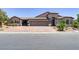Inviting one-story home featuring a three-car garage and a beautifully paved driveway at 3906 Jacob Lake Cir, Las Vegas, NV 89118