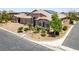 Charming single-story home with a desert landscape, two-car garage, and solar panels on the roof at 3906 Jacob Lake Cir, Las Vegas, NV 89118