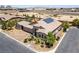 Single-story home featuring desert landscaping, a two-car garage, and roof-mounted solar panels at 3906 Jacob Lake Cir, Las Vegas, NV 89118