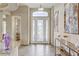 Elegant foyer with decorative art and statement lighting, leading to various rooms at 3906 Jacob Lake Cir, Las Vegas, NV 89118