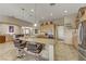 Kitchen with a large island, stainless steel appliances, granite countertops, and tile flooring at 3906 Jacob Lake Cir, Las Vegas, NV 89118