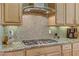 Gourmet kitchen featuring tile backsplash, stainless appliances, and granite countertops at 3906 Jacob Lake Cir, Las Vegas, NV 89118