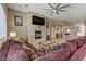 Cozy living room with fireplace, tile flooring, and an open concept layout at 3906 Jacob Lake Cir, Las Vegas, NV 89118