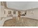 Open-concept living room featuring tiled floors, arched doorways, and stylish decor at 3906 Jacob Lake Cir, Las Vegas, NV 89118