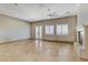Bright living room with natural light, tile flooring, and a cozy fireplace at 3906 Jacob Lake Cir, Las Vegas, NV 89118