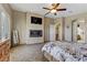 Comfortable main bedroom showcasing an electric fireplace and large windows at 3906 Jacob Lake Cir, Las Vegas, NV 89118