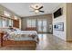 Bedroom featuring a fireplace, TV, and French doors to the outside at 3906 Jacob Lake Cir, Las Vegas, NV 89118