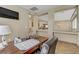 Bright office space featuring a dark wood desk, an executive chair, and decorative shelving at 3906 Jacob Lake Cir, Las Vegas, NV 89118