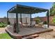 Virtually staged brick patio features pergola with seating, perfect for outdoor living at 3906 Jacob Lake Cir, Las Vegas, NV 89118