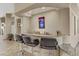Entertainer's wet bar with granite counters, bar seating, and recessed lighting at 3906 Jacob Lake Cir, Las Vegas, NV 89118