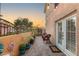 Cozy back patio with wrought iron railing and plants, perfect for relaxing outdoors at 3950 Candleglow Ct, Las Vegas, NV 89147