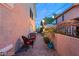 A charming backyard with a brick-paved walkway, seating area, and decorative string lights at 3950 Candleglow Ct, Las Vegas, NV 89147