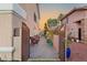 A charming backyard with a brick-paved walkway, seating area, and decorative string lights at 3950 Candleglow Ct, Las Vegas, NV 89147