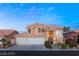 Charming two-story home boasting a three-car garage and inviting curb appeal at 3950 Candleglow Ct, Las Vegas, NV 89147