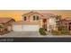 Stunning two-story home featuring a three-car garage and beautifully landscaped front yard at 3950 Candleglow Ct, Las Vegas, NV 89147