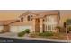Charming two-story home featuring a well-manicured yard and three-car garage at 3950 Candleglow Ct, Las Vegas, NV 89147