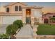 Charming two-story home with a well-manicured lawn and inviting front entrance at 3950 Candleglow Ct, Las Vegas, NV 89147