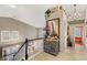 Elegant staircase and landing with decorative furnishings, chandelier, and views to living room at 3950 Candleglow Ct, Las Vegas, NV 89147
