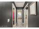 Hallway view leads to a luxurious bathroom with a soaking tub and a walk-in closet on the other side at 3950 Candleglow Ct, Las Vegas, NV 89147