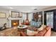 Comfortable living room with a stone fireplace, decorative rug, and lots of seating at 3950 Candleglow Ct, Las Vegas, NV 89147