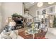 Elegant living room featuring staircase, stylish decor, and abundant natural light at 3950 Candleglow Ct, Las Vegas, NV 89147