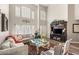 Bright living room showcasing high ceilings, large windows, and comfortable seating area at 3950 Candleglow Ct, Las Vegas, NV 89147