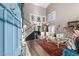 Grand entry with soaring ceilings, striking staircase, and elegant living area at 3950 Candleglow Ct, Las Vegas, NV 89147