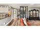 Bright living area with a decorative cabinet, hardwood floors, and open layout at 3950 Candleglow Ct, Las Vegas, NV 89147