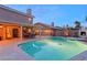 Sparkling pool and spa with covered patio and outdoor fireplace; great for entertaining at 3950 Candleglow Ct, Las Vegas, NV 89147