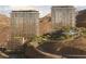 Luxury condos with panoramic views, lush landscaping, and resort-style pool nestled in a serene mountain setting at 400 Rock Peak Dr # 2402, Henderson, NV 89012