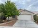Charming single-story home featuring a two-car garage, well-maintained landscaping, and a mature shade tree at 4607 Chestnut Blaze Dr, North Las Vegas, NV 89032