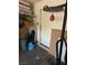 Shot of a garage interior filled with home goods with a door leading to the backyard at 4607 Chestnut Blaze Dr, North Las Vegas, NV 89032
