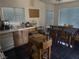 Kitchen with blue floors, wood cabinets, and stainless steel appliances at 4607 Chestnut Blaze Dr, North Las Vegas, NV 89032