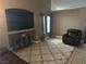 Carpeted living room with mounted television and natural light at 4607 Chestnut Blaze Dr, North Las Vegas, NV 89032