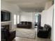Spacious living room with vaulted ceiling, recessed lighting, and a cozy seating arrangement at 4607 Chestnut Blaze Dr, North Las Vegas, NV 89032