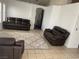 Open living room with vaulted ceiling, recessed lighting, and a comfortable seating arrangement at 4607 Chestnut Blaze Dr, North Las Vegas, NV 89032