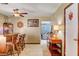 Charming bar area with wooden counter and stools in a home with lovely tile floors and neutral walls at 5019 Lancaster Dr, Las Vegas, NV 89120