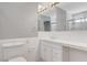 Clean bathroom featuring a toilet, sink with storage, and a window at 5019 Lancaster Dr, Las Vegas, NV 89120