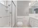 Clean bathroom featuring a tiled shower with glass door, toilet, and sink at 5019 Lancaster Dr, Las Vegas, NV 89120