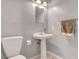 Bathroom featuring a pedestal sink, decorative mirror and soft lighting at 5019 Lancaster Dr, Las Vegas, NV 89120