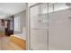 Bathroom featuring a tiled shower with glass door and a soaking tub at 5019 Lancaster Dr, Las Vegas, NV 89120