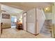 Welcoming hallway with tile flooring, a staircase, and a view into the living room at 5019 Lancaster Dr, Las Vegas, NV 89120