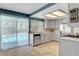 Inviting kitchen with a view of the pool, stainless steel appliances and white cabinets at 5019 Lancaster Dr, Las Vegas, NV 89120