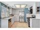 Bright kitchen with stainless steel appliances, white cabinets, and tiled countertops at 5019 Lancaster Dr, Las Vegas, NV 89120