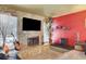 Stylish living area featuring a stone accent wall with a fireplace and contemporary furnishings at 5019 Lancaster Dr, Las Vegas, NV 89120
